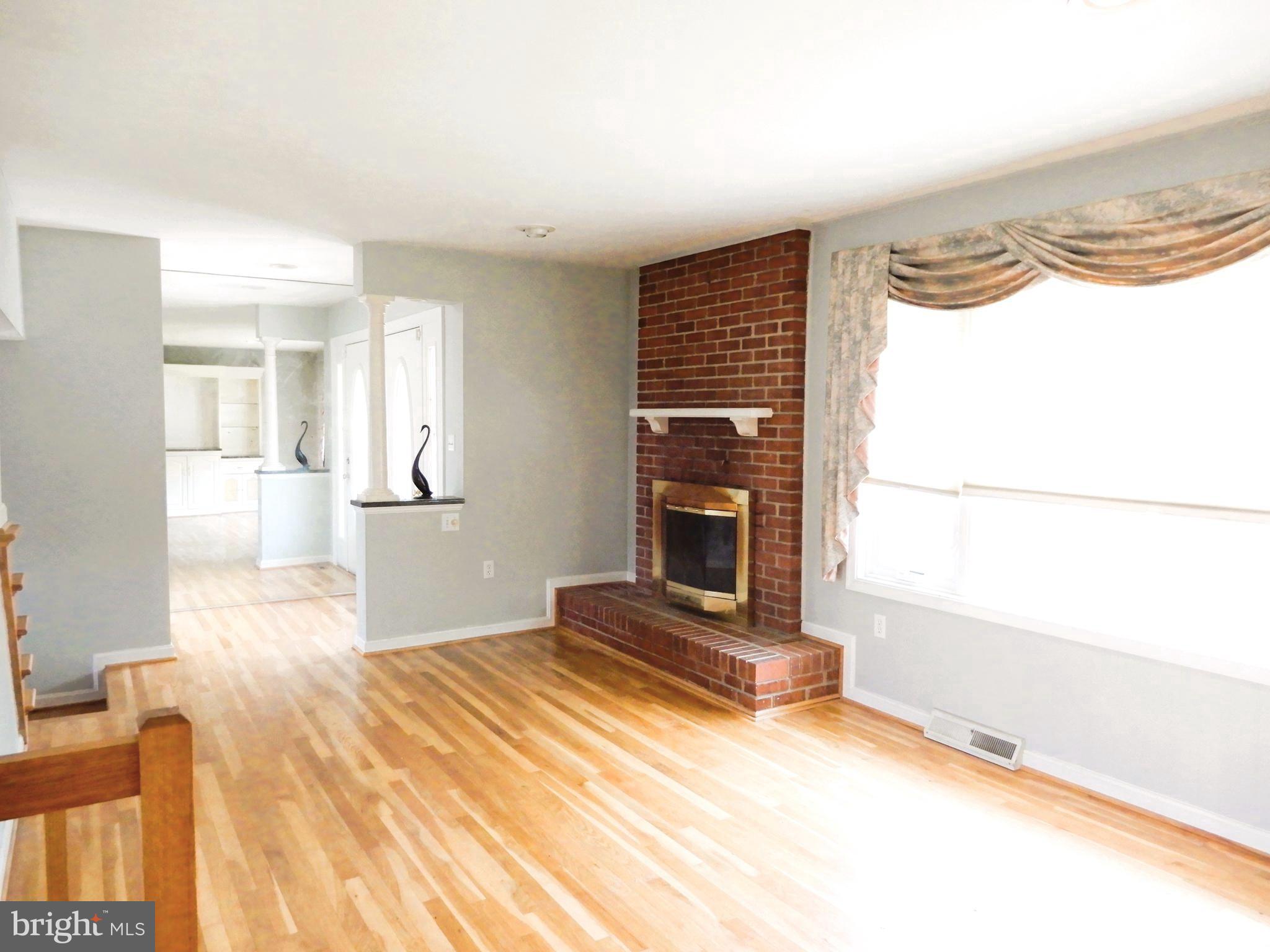 7638 Laurel Drive Pasadena, MD 21122 - Photo 13 of 51 a view of a livingroom with a fireplace