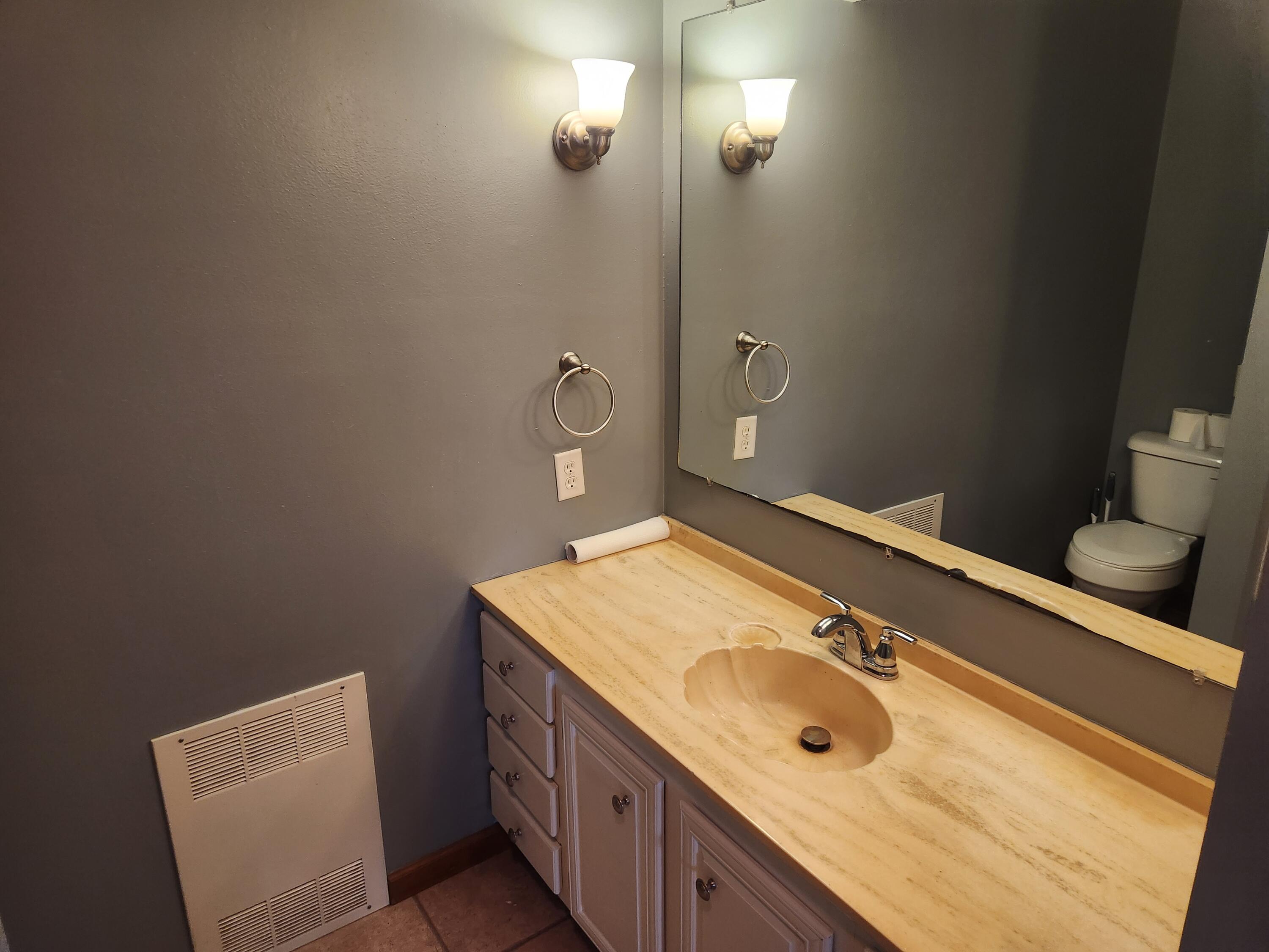 4726 Locksley Drive East Rensselaer, IN 47978 - Photo 32 of 33 a bathroom with a double vanity sink and a mirror