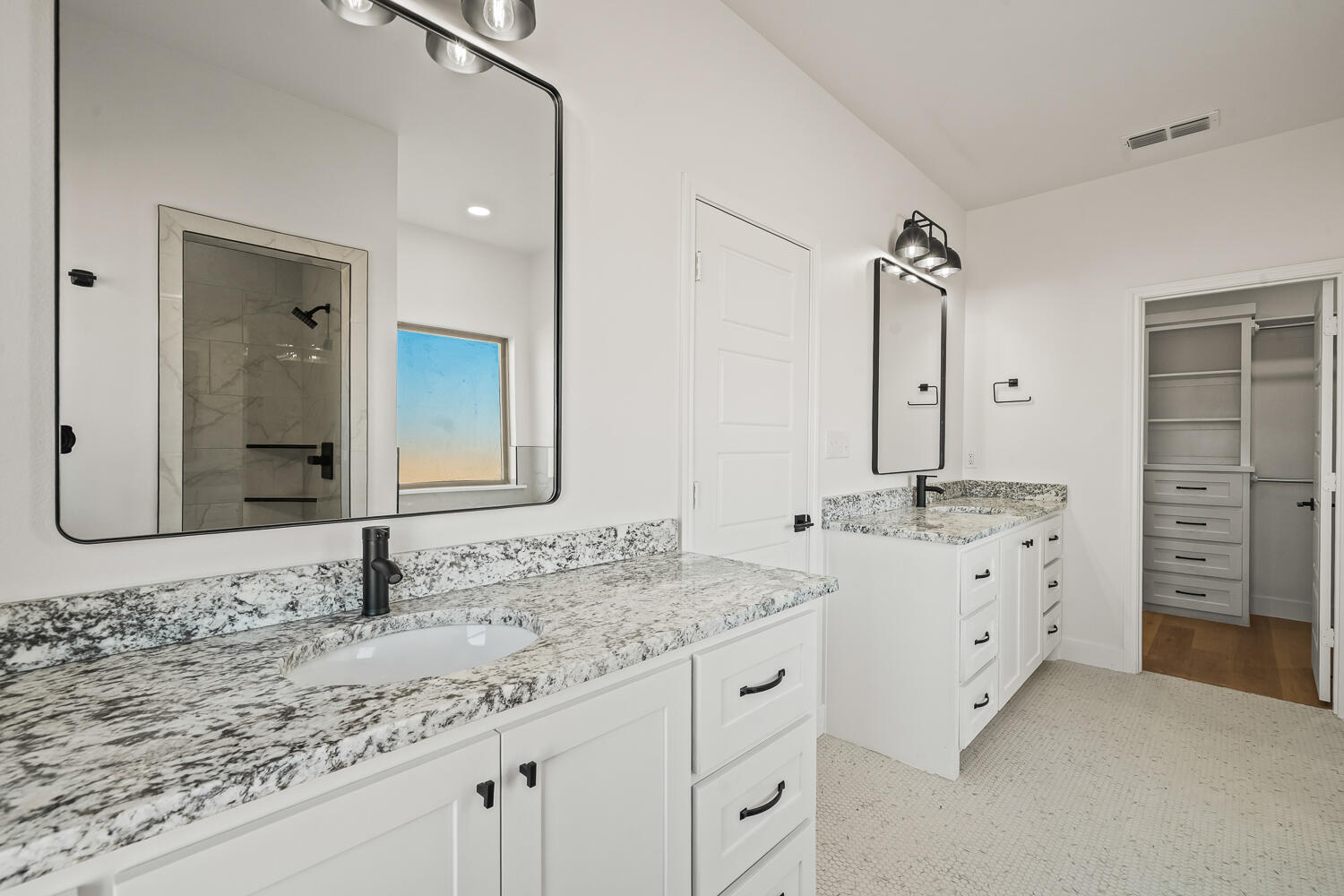 4062 Hawk Road Ropesville, TX 79358 - Photo 12 of 45 a bathroom with double sink and a mirror