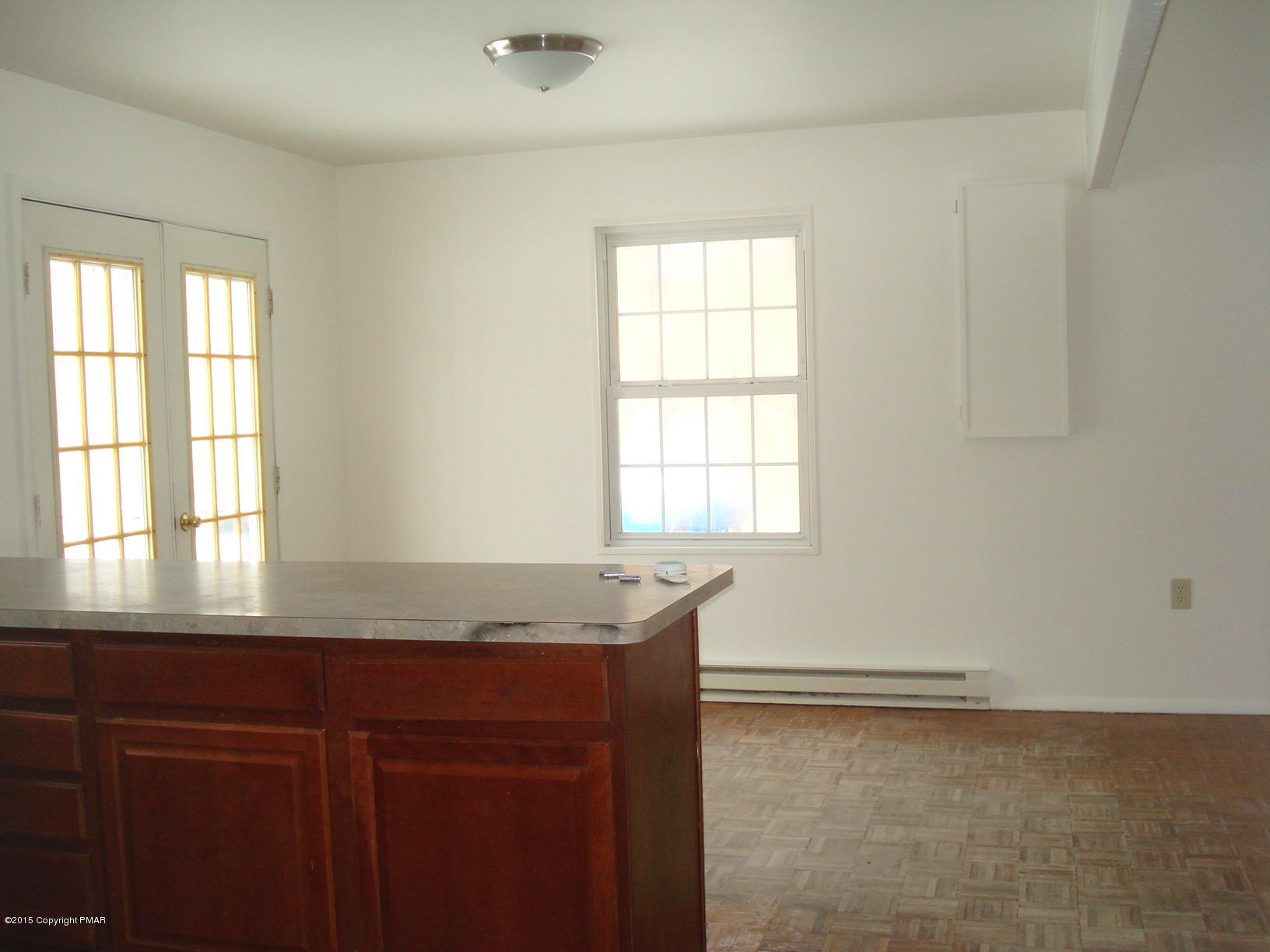 611 Gold Finch Road Bushkill, PA 18324 - Photo 8 of 16 a kitchen with granite countertop cabinets and window