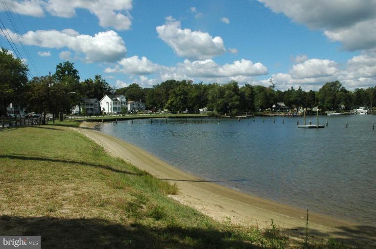 206 Oakwood Road Edgewater, MD 21037 - Photo 7 of 12 a view of a lake with houses in the back