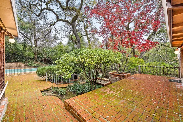 a view of a room with wooden floor and cabinet