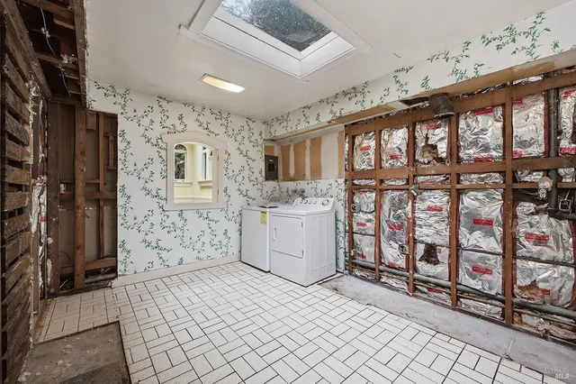 a hallway with a white stove a refrigerator and a cabinets