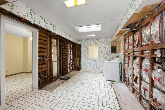 a bathroom with a bathtub and shower