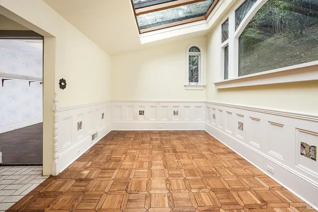 a view of a hallway with wooden shelves