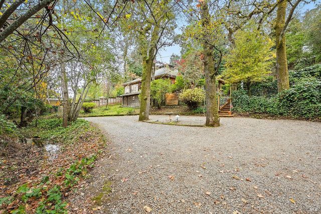 a backyard of a house with lots of green space