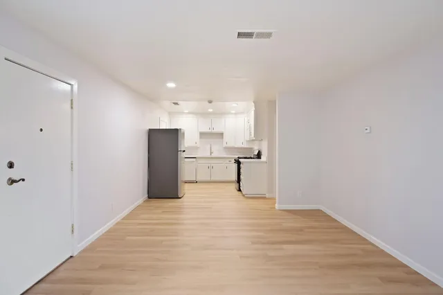 a view of kitchen with wooden floor