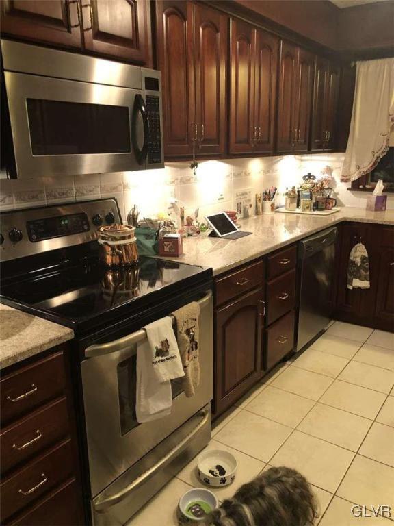 2936 River Road Mount Bethel, PA 18343 - Photo 13 of 20 a kitchen with a sink stove and cabinets