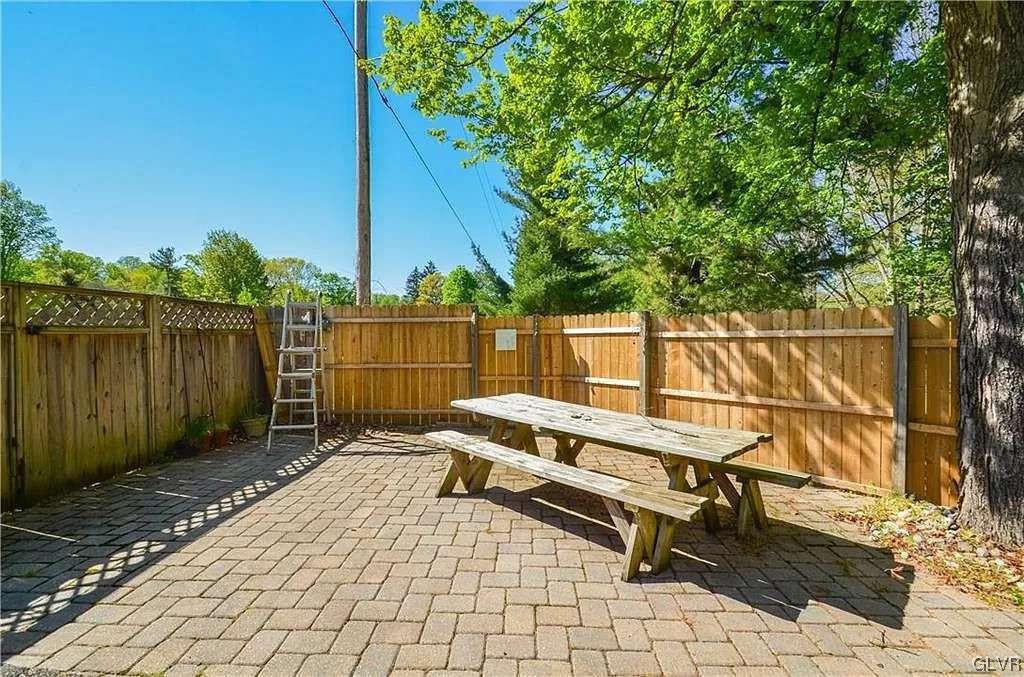 2936 River Road Mount Bethel, PA 18343 - Photo 15 of 20 a backyard of a house with a table and chairs