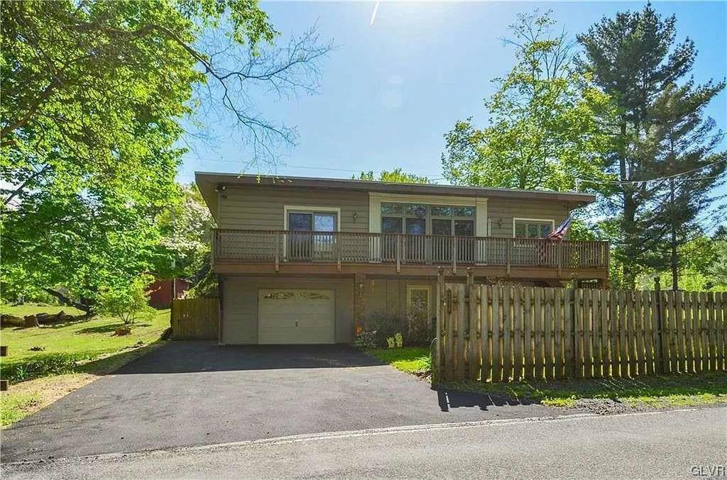 2936 River Road Mount Bethel, PA 18343 - Photo 2 of 20 a front view of a house with a garden