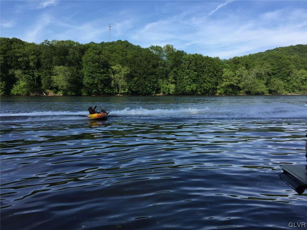 2936 River Road Mount Bethel, PA 18343 - Photo 5 of 20 a view of a lake with a mountain