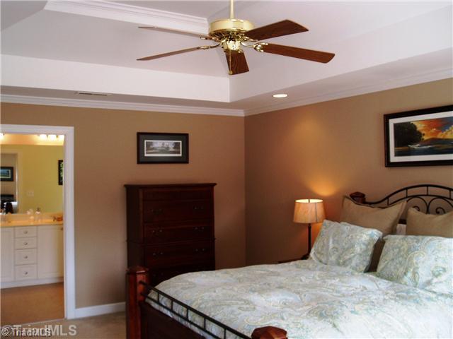 8052 Glengarriff Road Clemmons, NC 27012 - Photo 11 of 16 Master Bedroom. Crown molding, trey ceiling, fan.