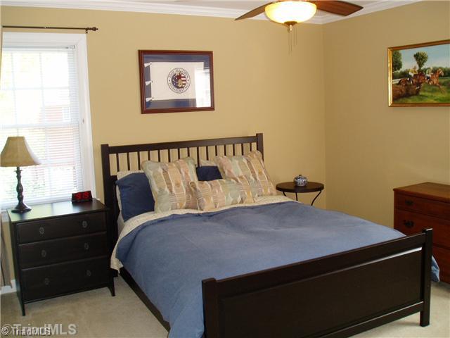8052 Glengarriff Road Clemmons, NC 27012 - Photo 13 of 16 2nd Bedroom. Carpet, crown molding, and clean. Double closet