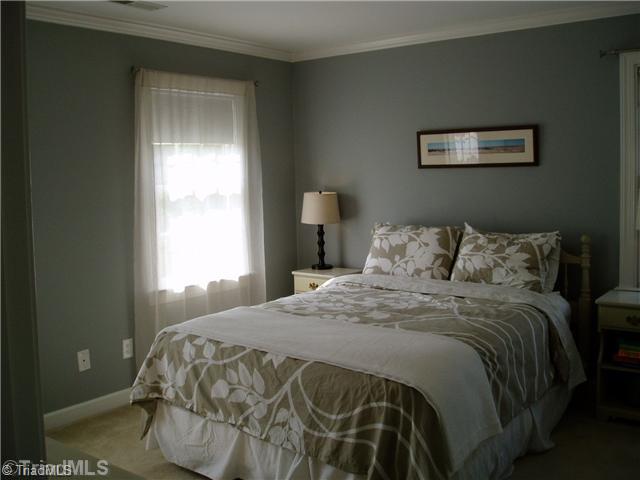 8052 Glengarriff Road Clemmons, NC 27012 - Photo 14 of 16 3rd Bedroom. Carpet, crown molding, double closet.