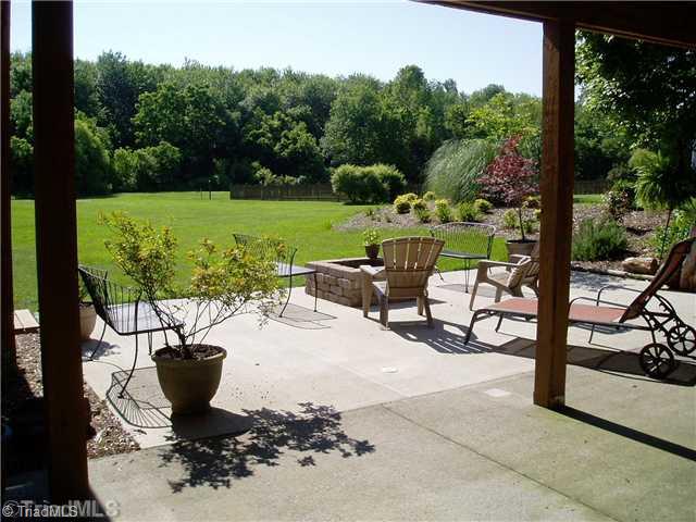 8052 Glengarriff Road Clemmons, NC 27012 - Photo 16 of 16 Patio/Deck. Large ground level patio for entertaining or can be used for extra covered parking.