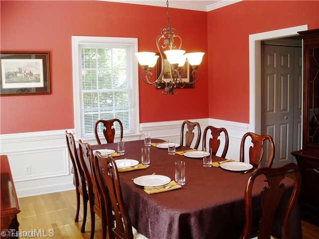 8052 Glengarriff Road Clemmons, NC 27012 - Photo 10 of 16 Dining Room. Crown molding, hardwoods, shadow box accents.