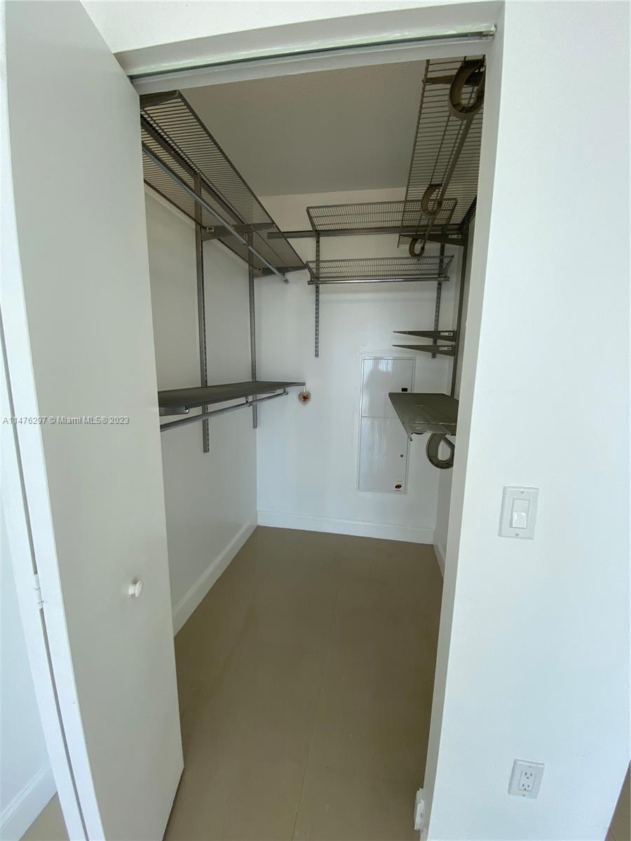 185 Southwest 7th Street, Unit 4110 Miami, FL 33130 - Photo 8 of 14 a view of a room with racks on the wall