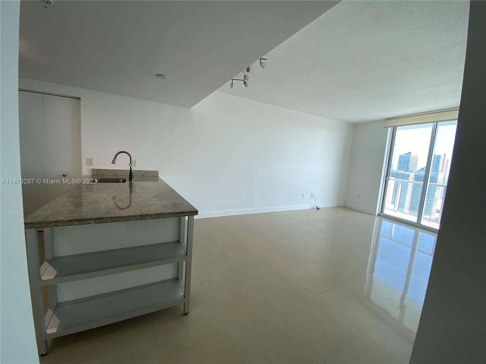 185 Southwest 7th Street, Unit 4110 Miami, FL 33130 - Photo 10 of 14 a bathroom with a sink and vanity