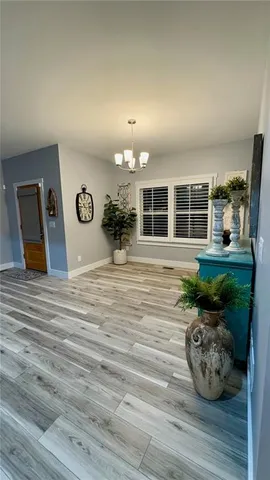 a room with lots of wooden furniture and a rug