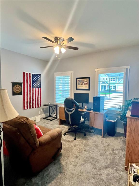 566 Clinton Drive Temple, GA 30179 - Photo 21 of 40 a living room with furniture ceiling fan and a window