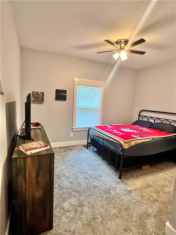 566 Clinton Drive Temple, GA 30179 - Photo 23 of 40 a bedroom with bed and window