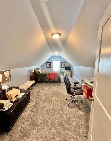 a bedroom with bed and gym equipment