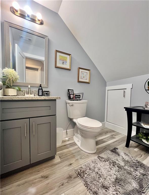 566 Clinton Drive Temple, GA 30179 - Photo 26 of 40 a bathroom with a toilet a sink and mirror