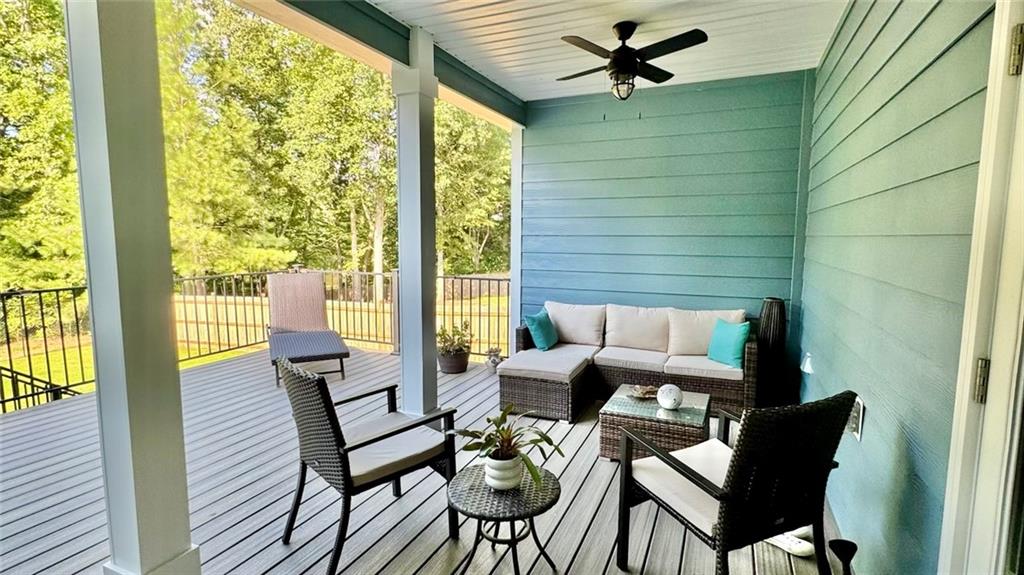 566 Clinton Drive Temple, GA 30179 - Photo 27 of 40 a living room with furniture and a floor to ceiling window