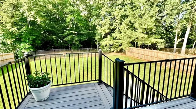 a view of a balcony with wooden floor