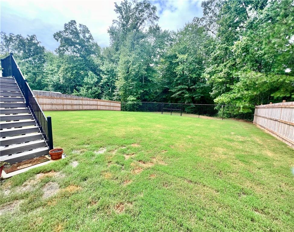 566 Clinton Drive Temple, GA 30179 - Photo 32 of 40 a view of a garden with stairs