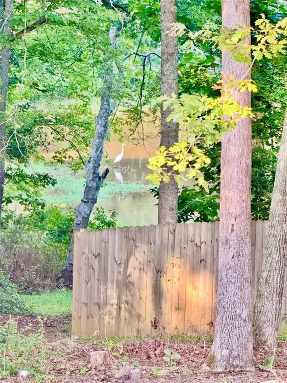 566 Clinton Drive Temple, GA 30179 - Photo 33 of 40 a wooden fence with trees in the background