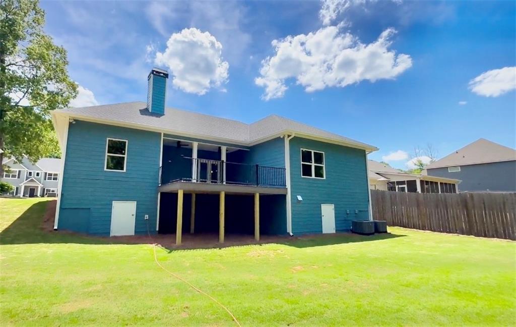 566 Clinton Drive Temple, GA 30179 - Photo 34 of 40 a front view of a house with a yard and garage
