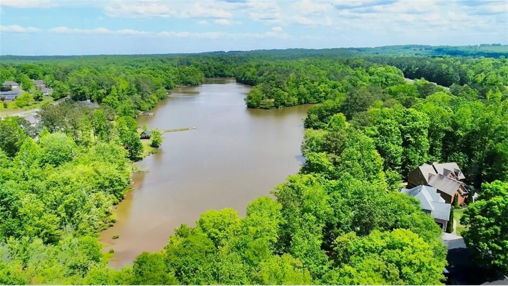 566 Clinton Drive Temple, GA 30179 - Photo 36 of 40 an aerial view of a house with a yard and lake view