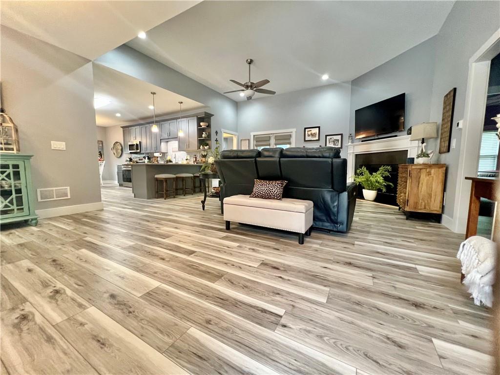 566 Clinton Drive Temple, GA 30179 - Photo 4 of 40 a living room with furniture and a flat screen tv