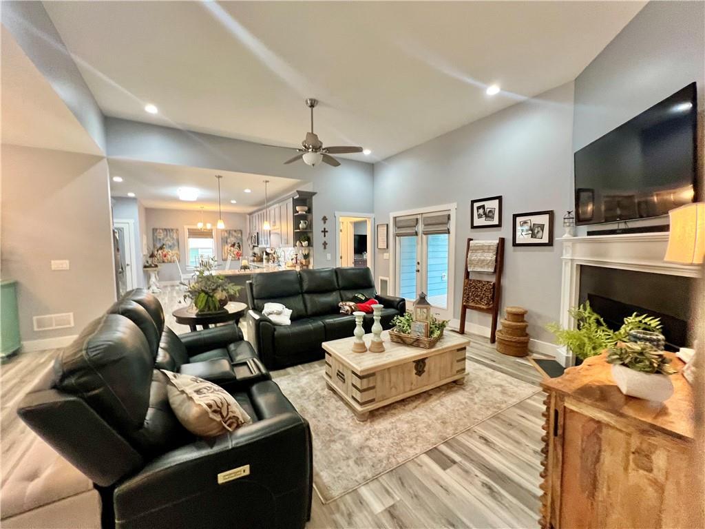 566 Clinton Drive Temple, GA 30179 - Photo 5 of 40 a living room with fireplace furniture and a flat screen tv