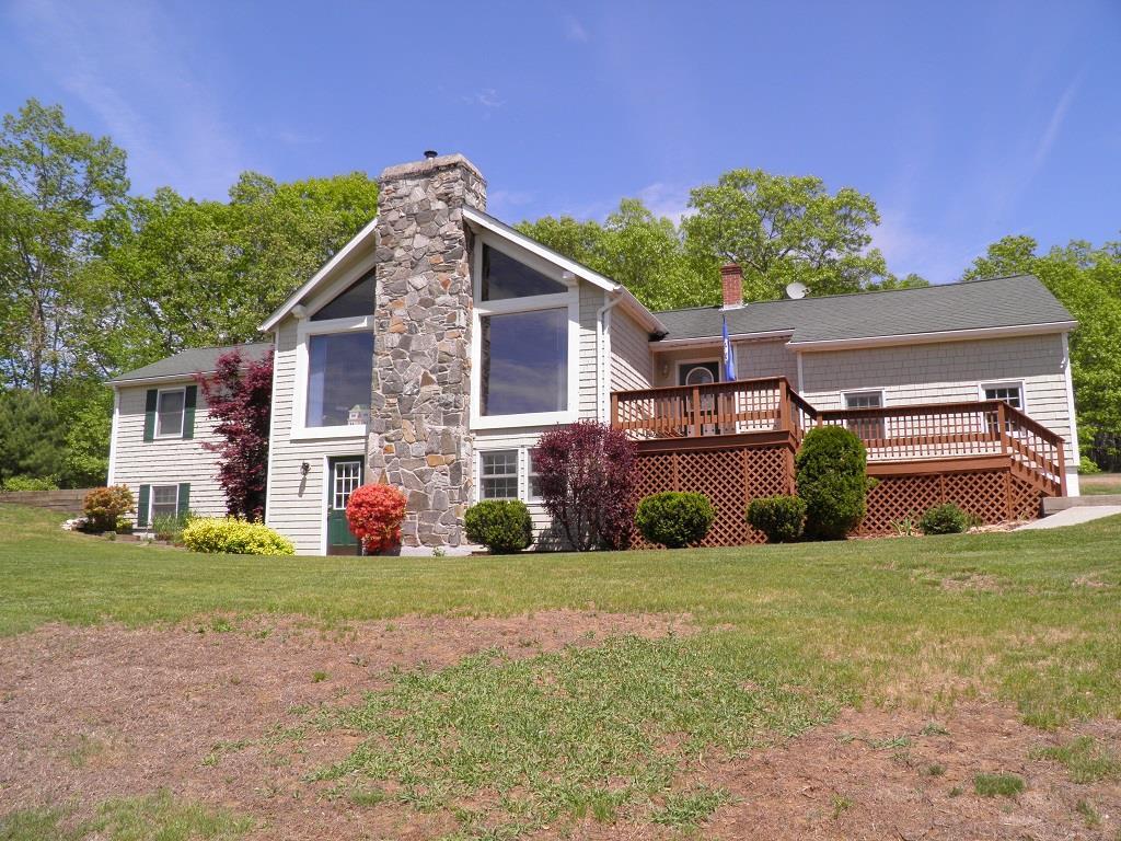 542 Wauregan Road Killingly, CT 06239 - Photo 1 of 1 a view of a house with a yard