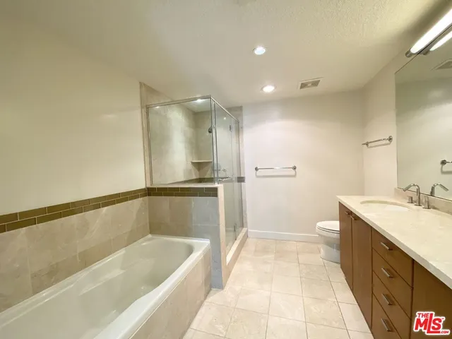 a bathroom with a bathtub and a sink