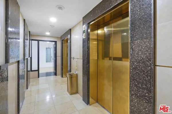 a bathroom with a shower and a sink