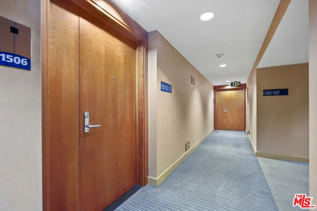 a view of hallway with wooden floor