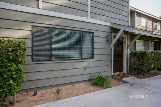 199 East Upjohn Avenue Ridgecrest, CA 93555 - Photo 3 of 30 a front view of a house with a yard