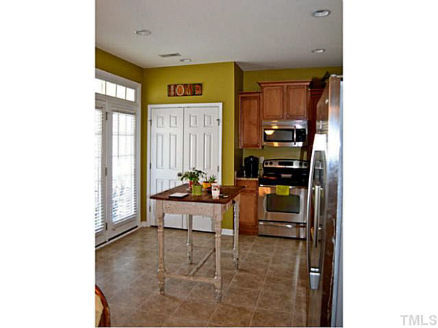 1364 Regulator Street Raleigh, NC 27603 - Photo 11 of 24 a living room with furniture and a window
