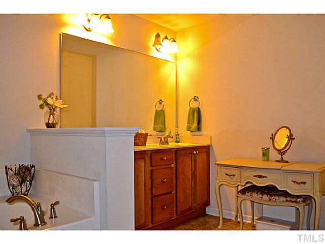 1364 Regulator Street Raleigh, NC 27603 - Photo 17 of 24 a bathroom with a sink and a mirror