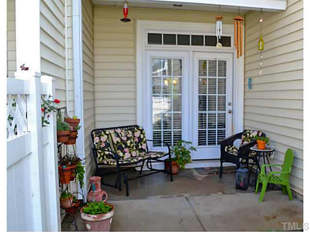 1364 Regulator Street Raleigh, NC 27603 - Photo 21 of 24 a building outdoor space with patio furniture and potted plants