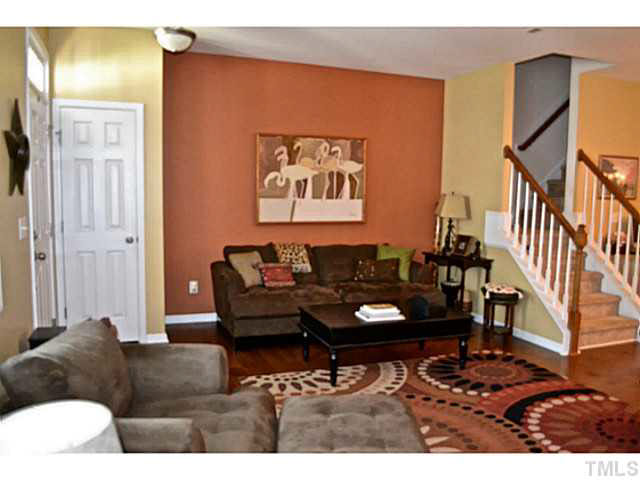 1364 Regulator Street Raleigh, NC 27603 - Photo 4 of 24 a living room with furniture and a potted plant