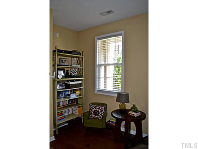 1364 Regulator Street Raleigh, NC 27603 - Photo 5 of 24 a living room with furniture and wooden floor