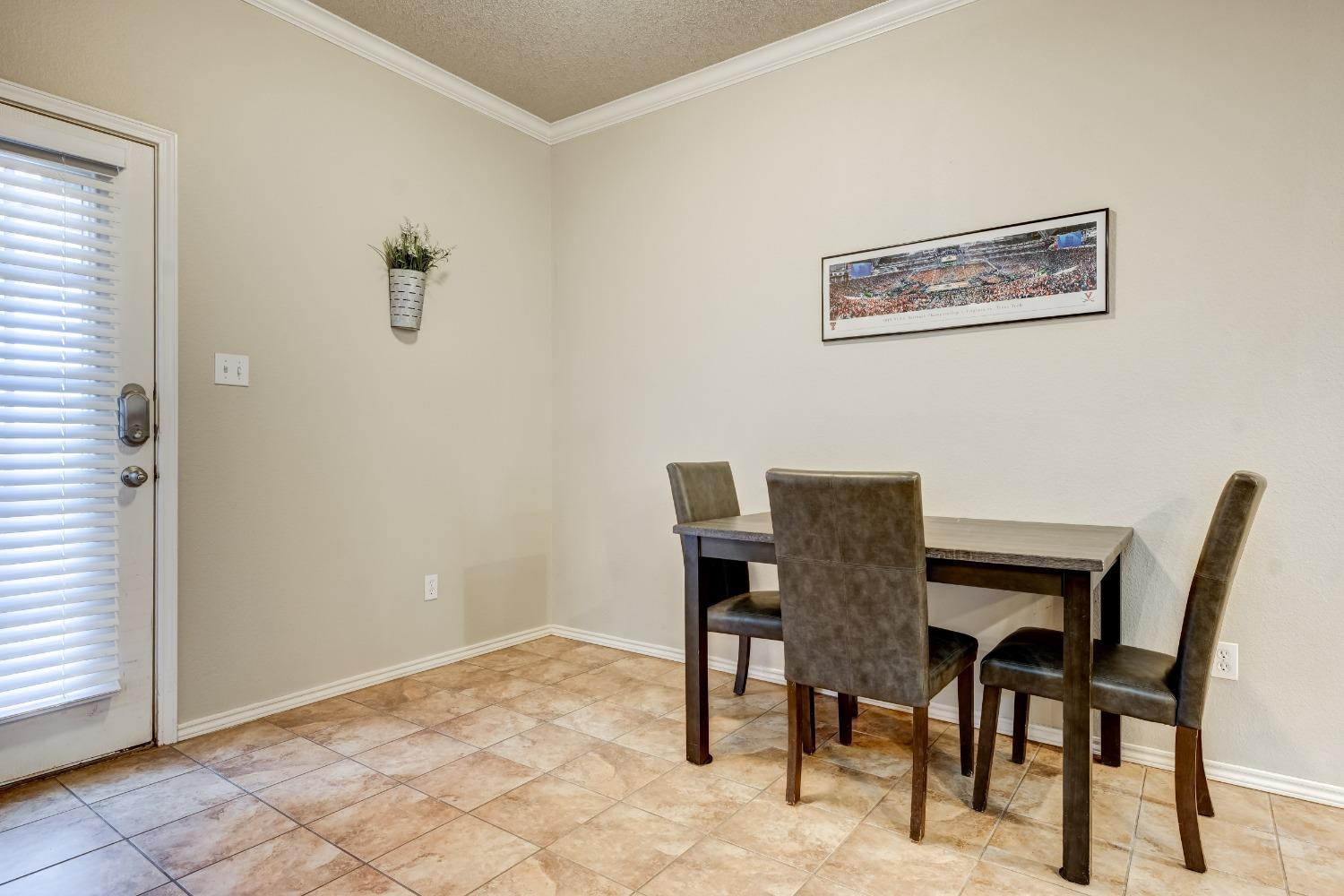 2102 Main Street, Unit 5 Lubbock, TX 79401 - Photo 12 of 27 a view of a dining room with furniture