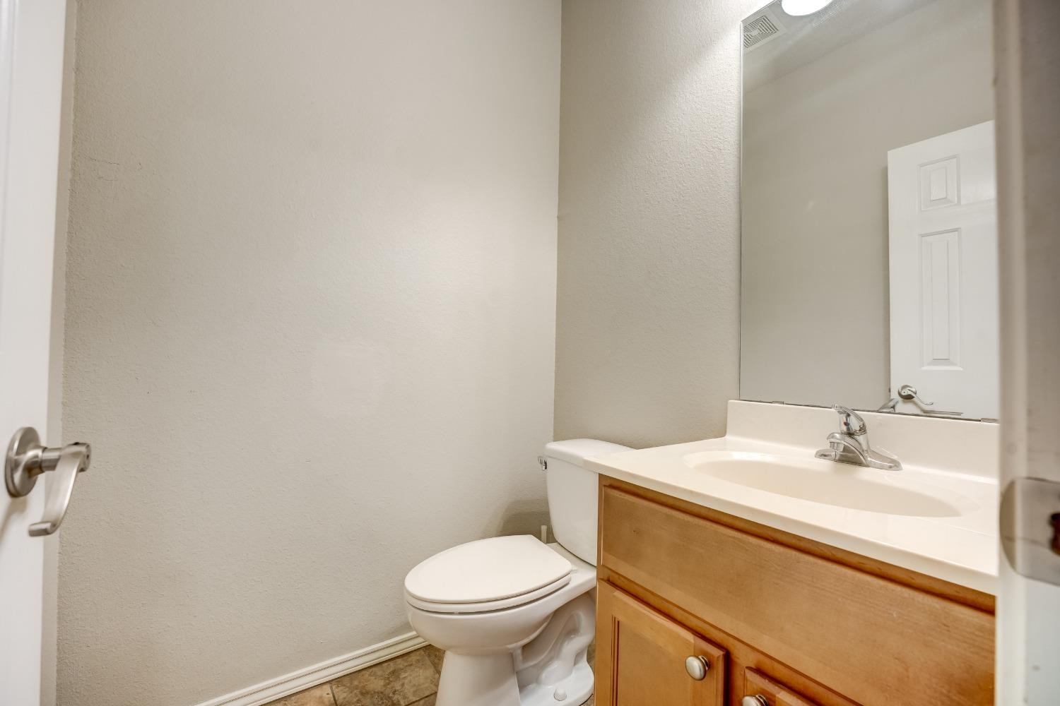 2102 Main Street, Unit 5 Lubbock, TX 79401 - Photo 14 of 27 a bathroom with a sink and a toilet