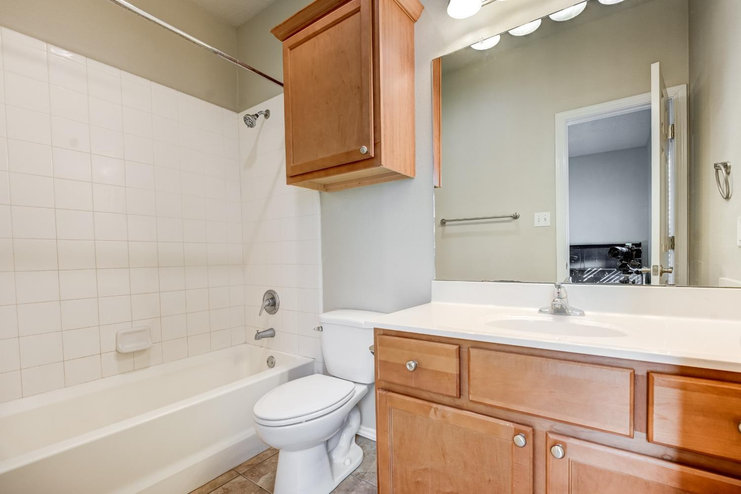 2102 Main Street, Unit 5 Lubbock, TX 79401 - Photo 21 of 27 a bathroom with a sink a toilet and bathtub