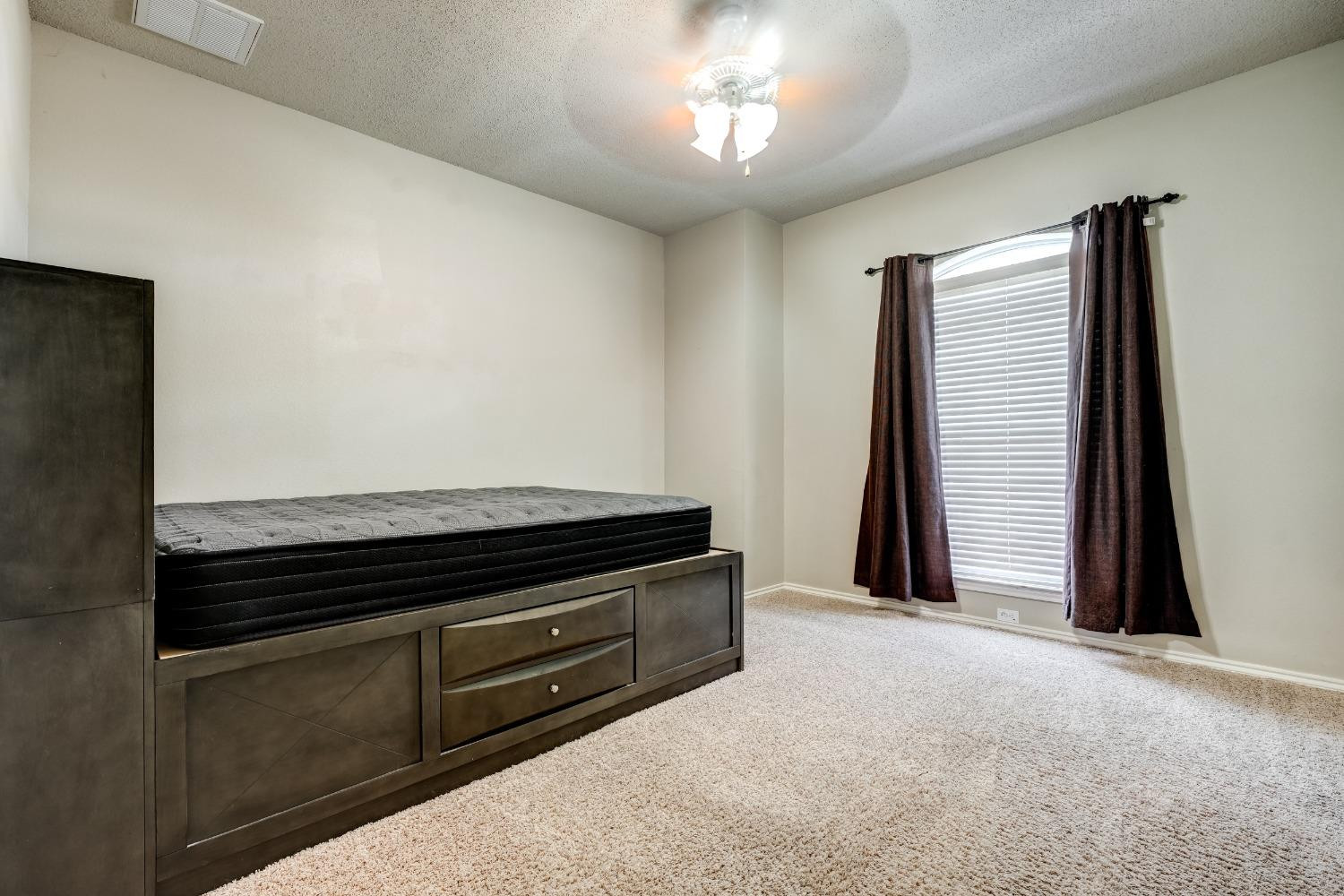2102 Main Street, Unit 5 Lubbock, TX 79401 - Photo 22 of 27 a view of an empty room with a window