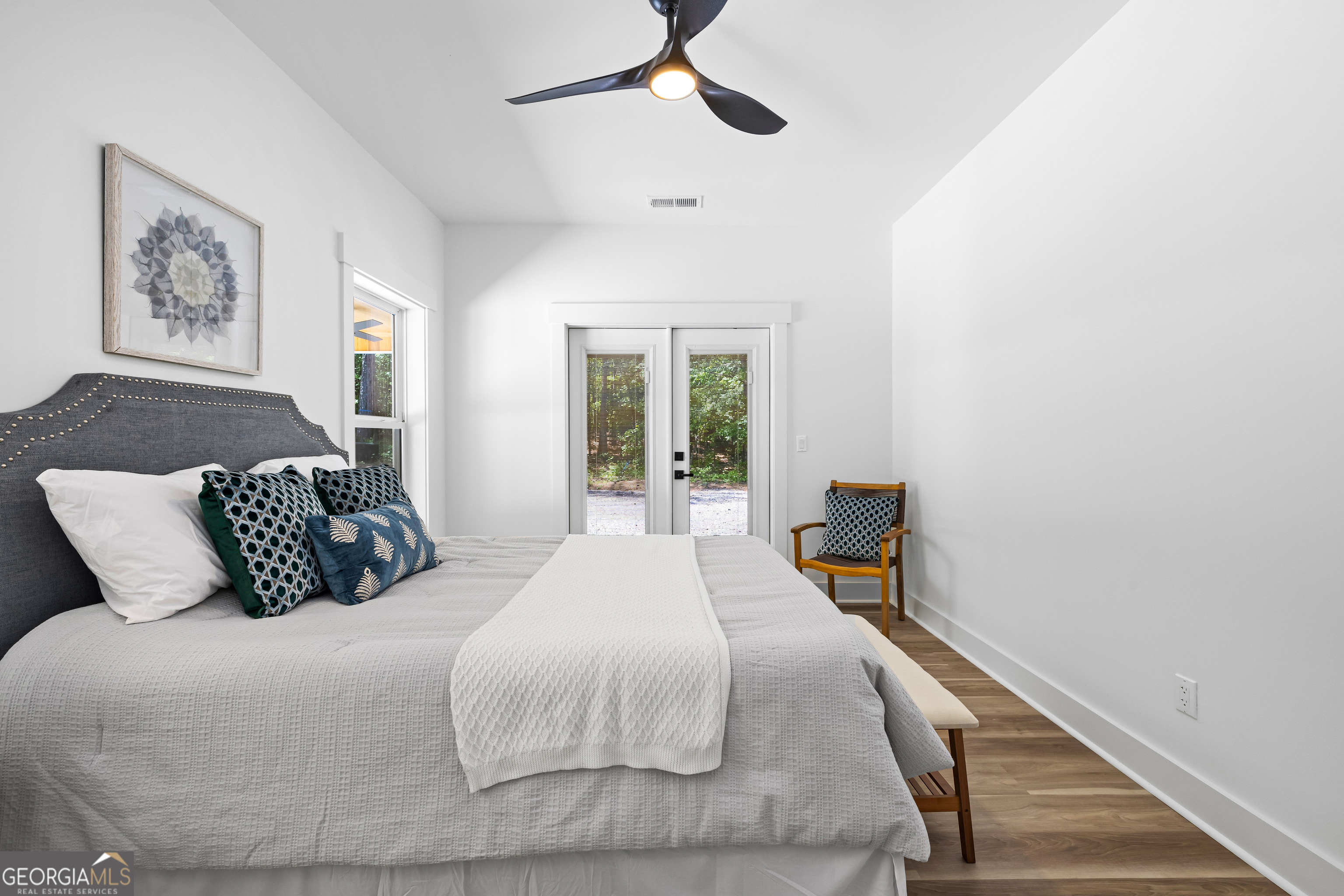354 Turner Road Newnan, GA 30263 - Photo 46 of 79 a bedroom with a large bed and a chandelier